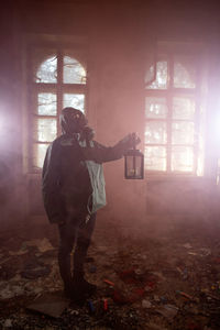 Man standing in abandoned building