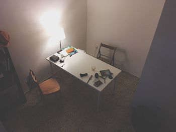 High angle view of illuminated lamp on table at home