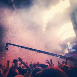 People enjoying music concert at night