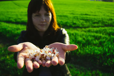 Woman standing on grassy field