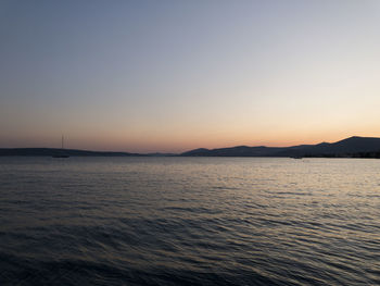 Scenic view of sea against clear sky during sunset