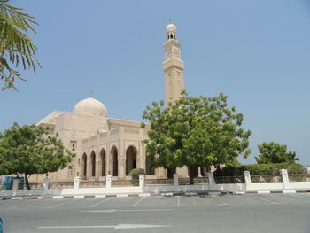 Low angle view of temple against clear blue sky