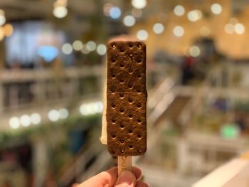 Close-up of hand holding ice cream cone