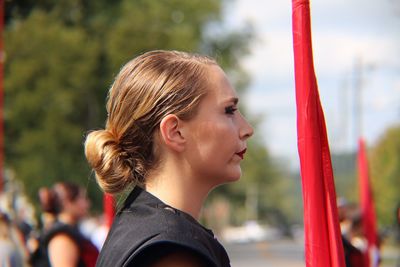 Portrait of smiling young woman against blurred background