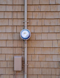 Low angle view of electric light on wall