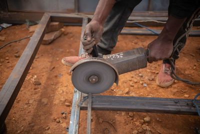 Zambian welder, welding , african man working with his hands 