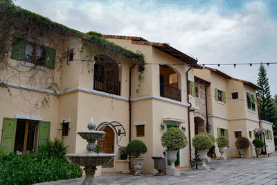 Low angle view of residential building against sky