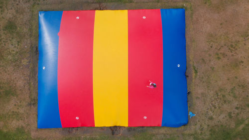 High angle view of multi colored umbrella on wall