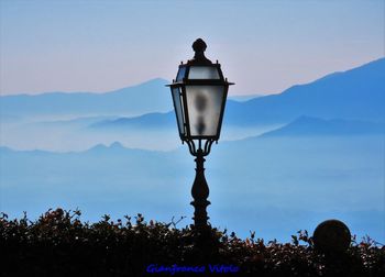 Street light against sky