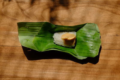 High angle view of leaves in plate on table