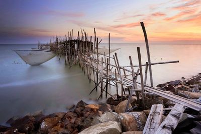 Scenic view of sea against sky at sunset