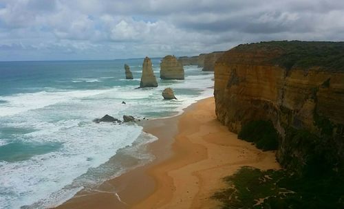 Scenic view of sea against cloudy sky