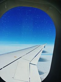 Airplane flying over blue sky