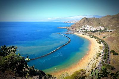 Scenic view of beach and blue sea against sky at playa de las teresitas