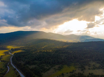 Scenic view of landscape against sky during sunset