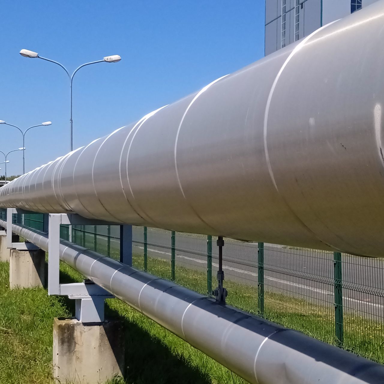 pipeline transport, pipe - tube, power generation, pipeline, industry, architecture, no people, nature, built structure, sky, fossil fuel, oil industry, outdoors, environment, technology, grass, day, business, environmental conservation, natural gas