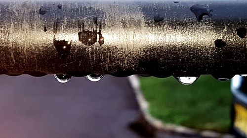 Close-up of water drops on metal during rainy season