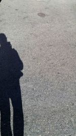 Shadow of people on road