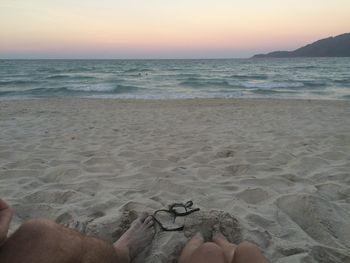 Scenic view of beach against sky during sunset