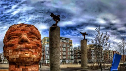 Low angle view of statue against cloudy sky