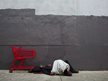 Homeless man sleeping on street