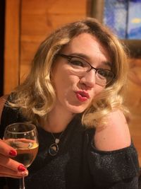 Close-up portrait of woman drinking glasses