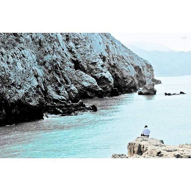 sea, water, rock formation, rock - object, tranquility, tranquil scene, rock, cliff, scenics, beauty in nature, horizon over water, nature, mountain, sky, idyllic, rocky, transfer print, coastline, geology, rocky mountains