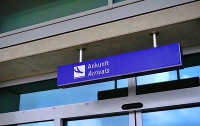 Low angle view of information sign on building
