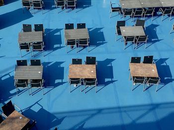 High angle view of chairs and tables against building