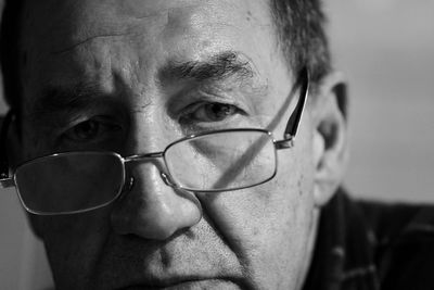 Close-up portrait of man wearing eyeglasses