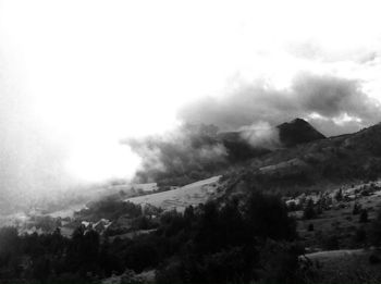 Scenic view of mountains in foggy weather