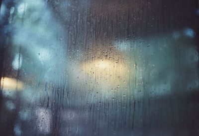 Full frame shot of wet window in rainy season