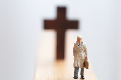 Cross standing on wood