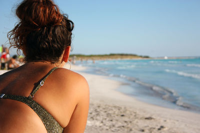 Rear view of woman looking at sea