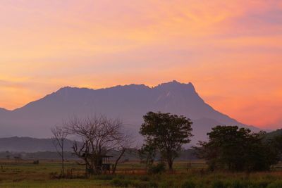 Scenic view of mountains against sky during sunset