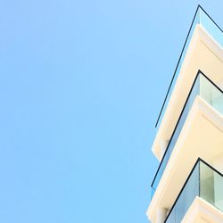 Low angle view of building against clear blue sky