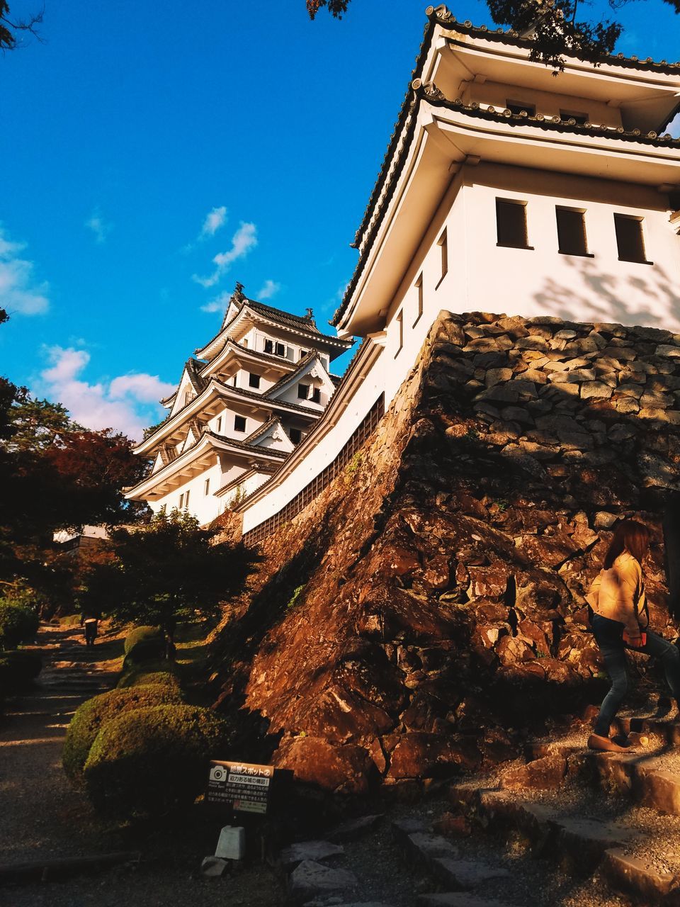 LOW ANGLE VIEW OF TEMPLE AGAINST BUILDING