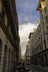 Street amidst buildings in city against sky