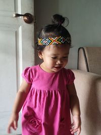 Cute girl looking away at home