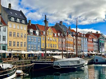 Boats moored at harbor
