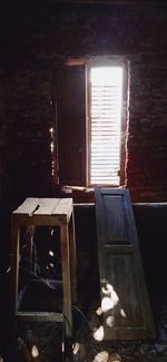 Sunlight streaming through window in abandoned building