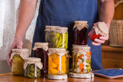 Midsection of man preparing food on table