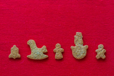 High angle view of cookies on red table