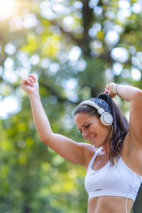 Portrait of young woman standing outdoors