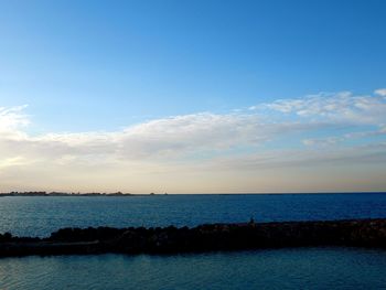 Scenic view of sea against blue sky