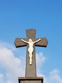 Low angle view of statue against blue sky