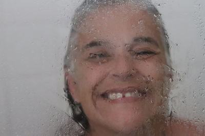 Close-up of wet smiling