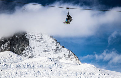 Overhead cable car against sky