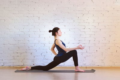 Side view of man against wall