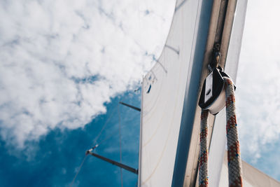 Sailboat sailing on sea against sky